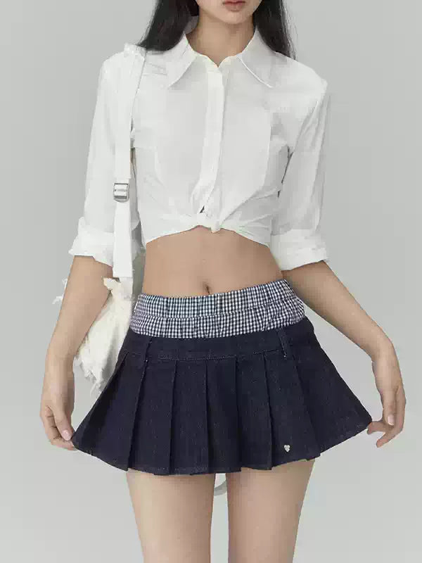 Pleated denim A-line mini skirt in navy blue