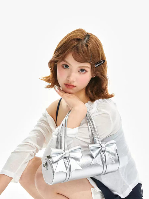 Double ribbon underarm shoulder bag in silver