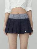 Pleated denim A-line mini skirt in navy blue
