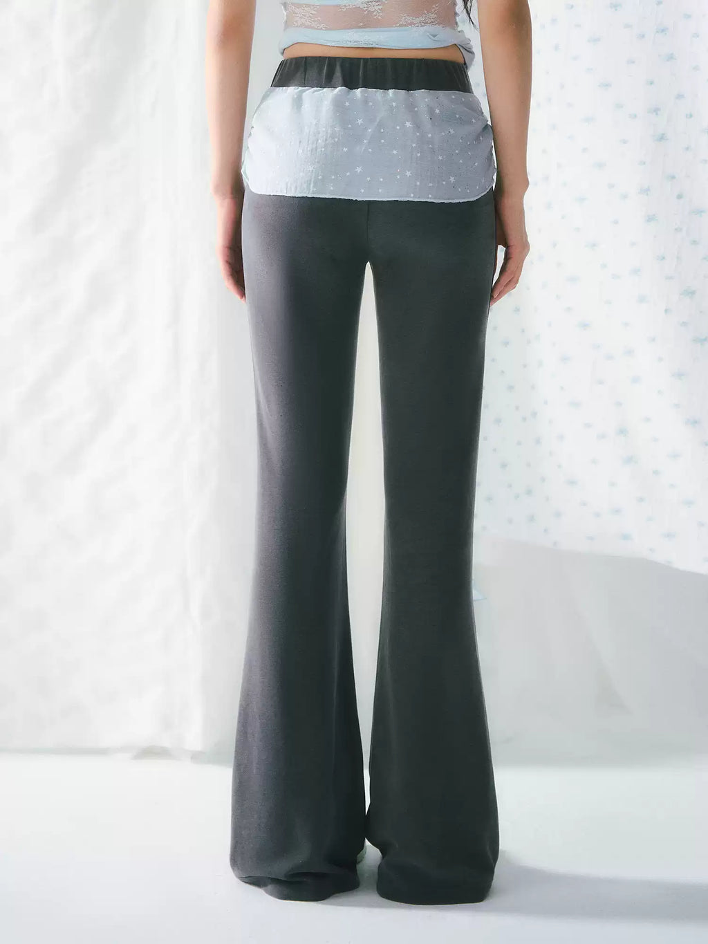 High-waisted flared pants with ribbon detail