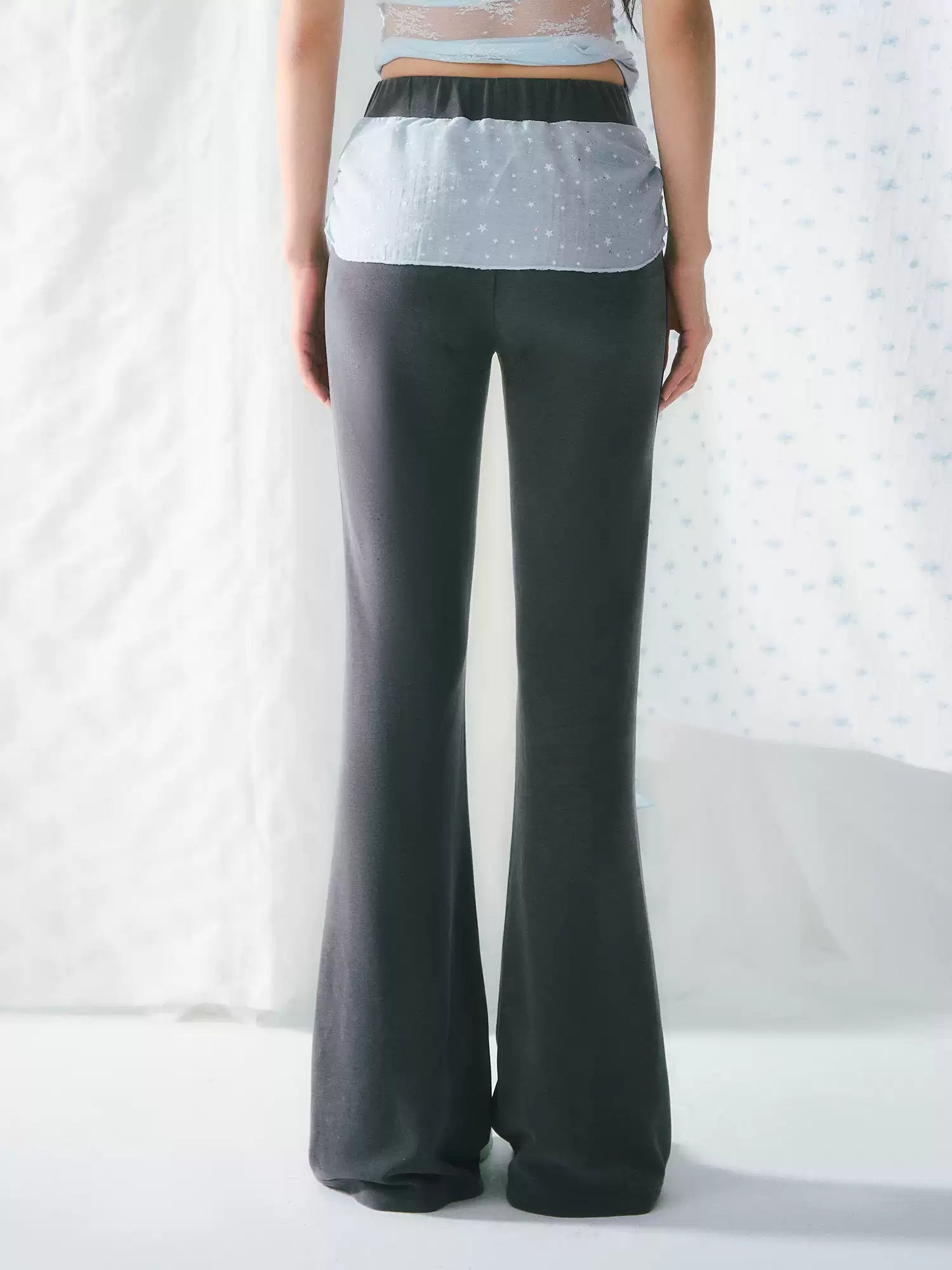 High-waisted flared pants with ribbon detail