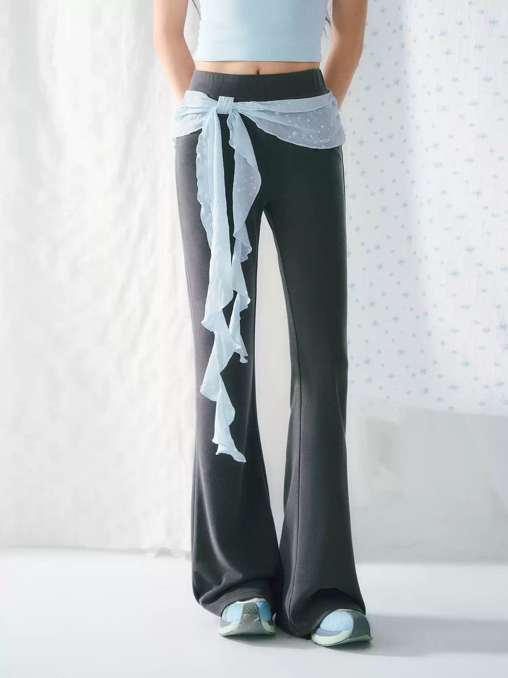 High-waisted flared pants with ribbon detail