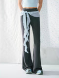 High-waisted flared pants with ribbon detail