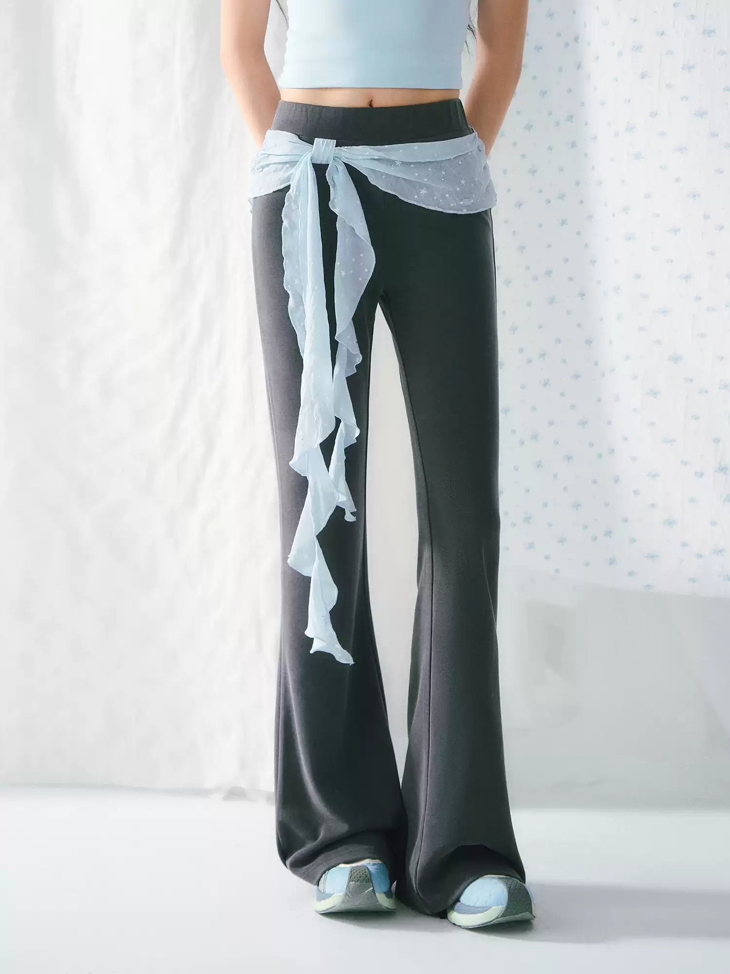 High-waisted flared pants with ribbon detail